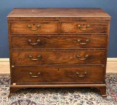 Lot 2747 - A George III mahogany chest of four graduated...