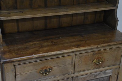 Lot 1042 - An old pine dresser, with boarded plate rack...