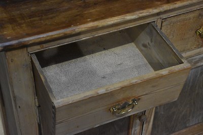 Lot 1042 - An old pine dresser, with boarded plate rack...