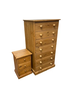 Lot 1057 - A modern pine pillar type seven drawer chest,...