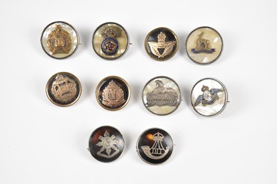 Lot 185 - A collection of ten military cap badges, to...