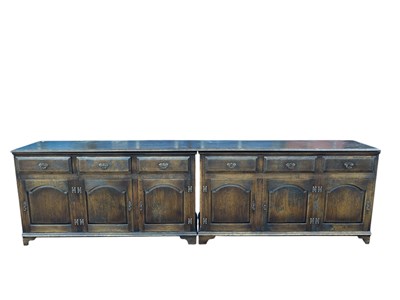 Lot 1067 - ROYAL OAK; a large reproduction oak sideboard,...