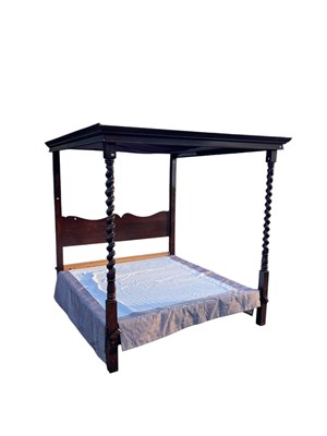 Lot 1068 - A good quality reproduction oak four poster bed.