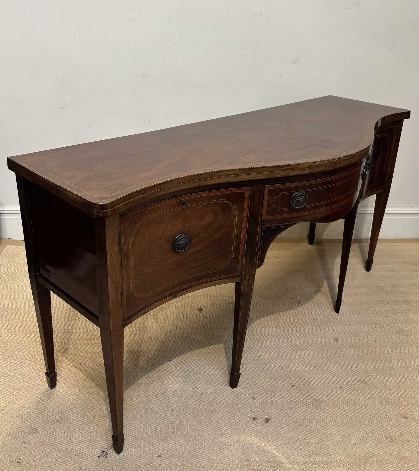 Lot 1140 - A George III inlaid mahogany serpentine...