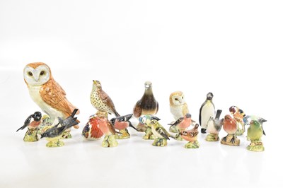 Lot 603 - BESWICK; a collection of bird models including...