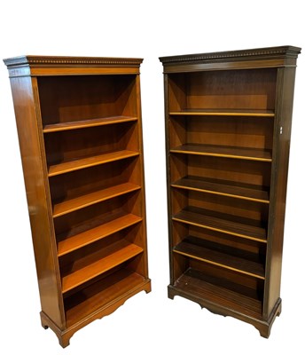 Lot 1081 - A modern walnut open bookcase with five...