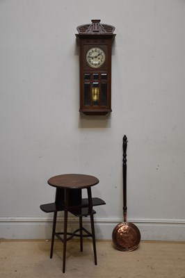 Lot 271 - An early 20th century oak wall clock, the...