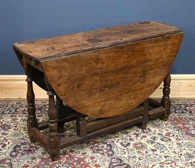 Lot 2990 - An 18th century and later oak gateleg table,...