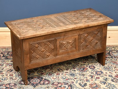 Lot 2956 - A carved hard wood coffer, with geometric...