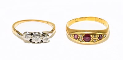 Lot 1164 - Two yellow metal rings, marks worn, gross...