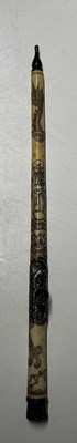 Lot 390 - A Chinese bone opium pipe, 47cm, decorated...