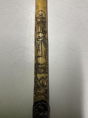 Lot 390 - A Chinese bone opium pipe, 47cm, decorated...
