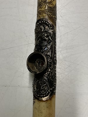 Lot 390 - A Chinese bone opium pipe, 47cm, decorated...