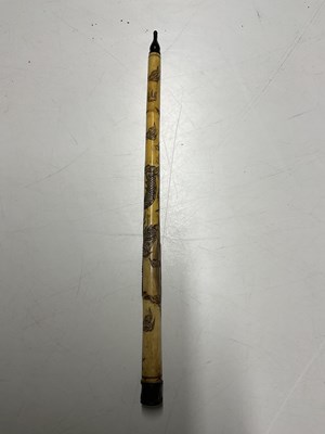 Lot 390 - A Chinese bone opium pipe, 47cm, decorated...