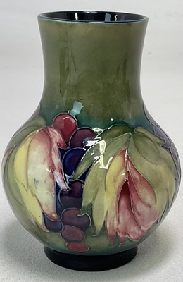 Lot 232 - MOORCROFT; an early 'Leaf and Berry' decorated...