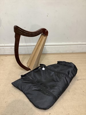 Lot 248 - A small modern carved hardwood harp, height...