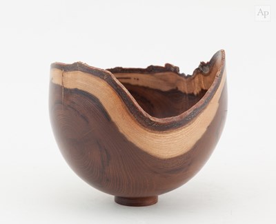 Lot 759 - A turned laburnum bowl with natural edge in...