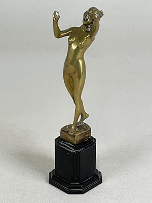 Lot 213 - An early 20th century polished brass figure of...