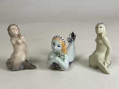 Lot 244 - ROYAL COPENHAGEN; three figures of mermaids,...