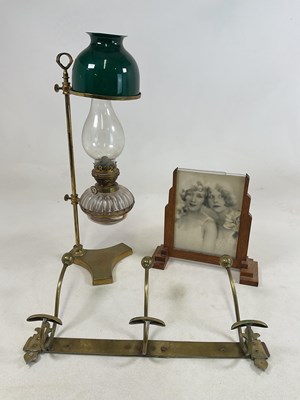 Lot 204 - An unusual brass lamp with adjustable dished...