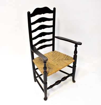 Lot 50 - A 19th century ladder back armchair with rush...