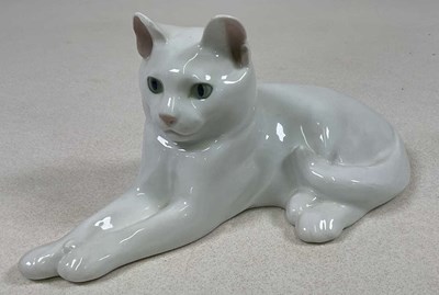 Lot 264 - ROYAL COPENHAGEN; a white glazed cat, in a...