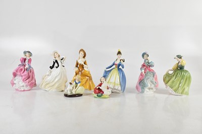 Lot 600 - ROYAL DOULTON; a collection of eight figures...