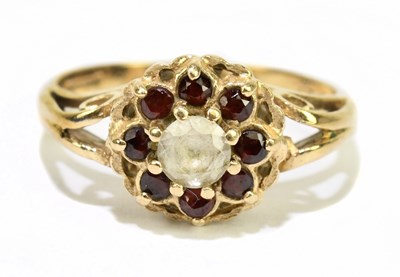 Lot 1135 - A 9ct yellow gold garnet set dress ring, size...