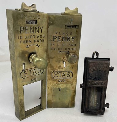 Lot 71 - A pair of penny in the slot brass toilet door...