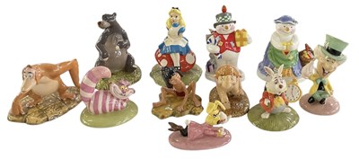 Lot 557 - ROYAL DOULTON; nine ceramic figures from the...