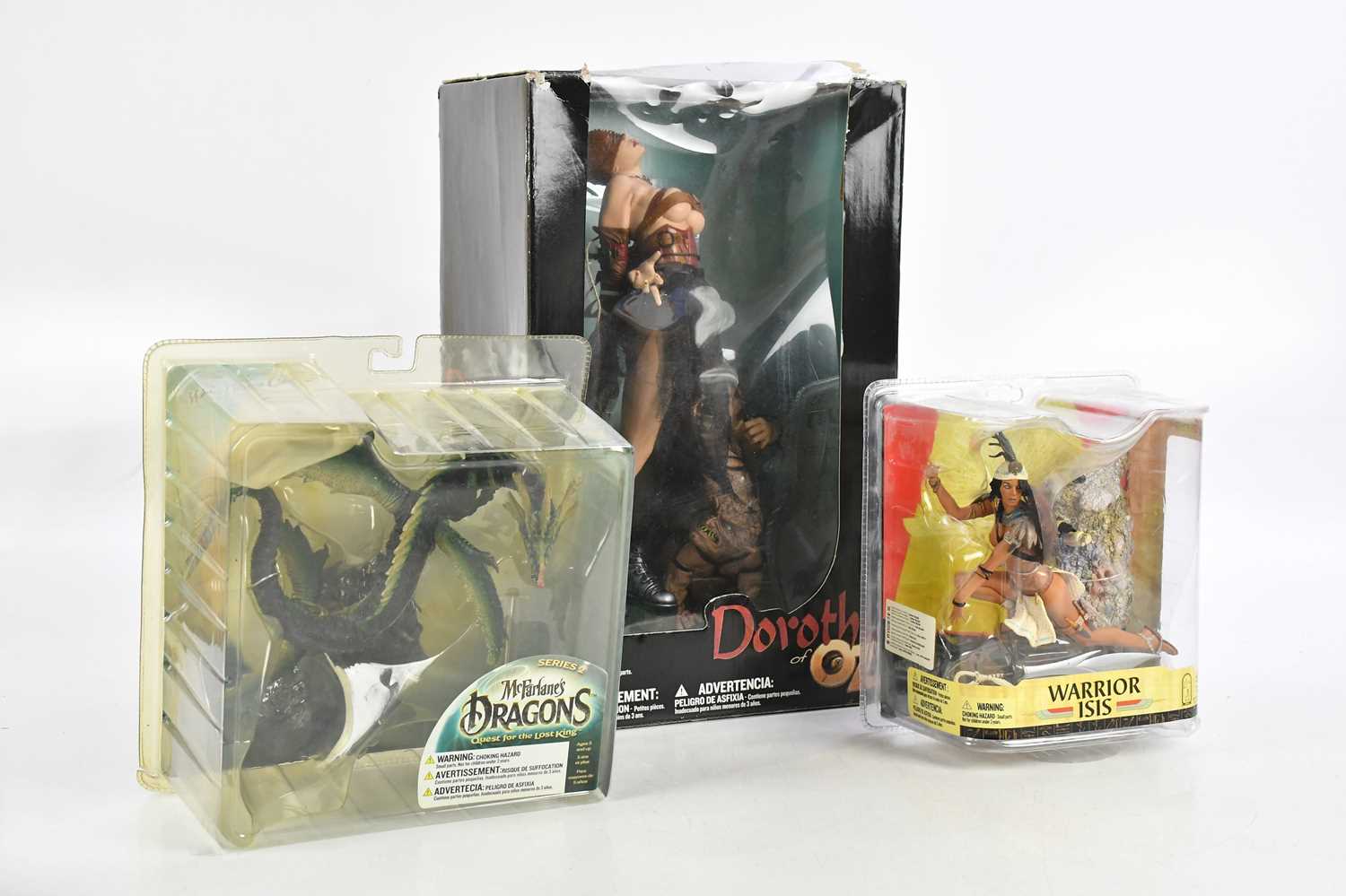 Lot 831 - Three boxed action figure by McFarlane Toys,...
