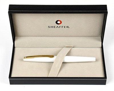 Lot 137 - SHEAFFER; a white fountain pen, in original...