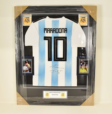 Lot 4 - DIEGO MARADONA; a framed display featuring a...