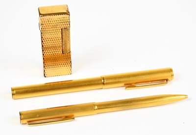 Lot 1043 - DUNHILL; a gold plated fountain pen with 14ct...
