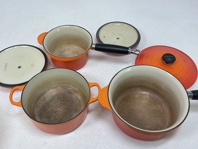 Lot 197 - LE CREUSET; a Volcanic Orange cast iron round...