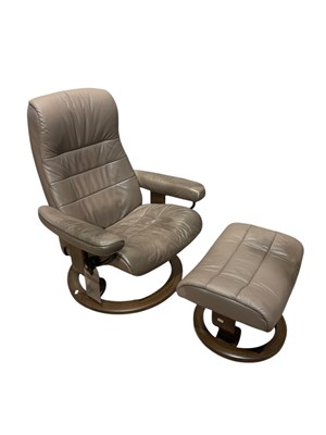 Lot 1092 - A Stressless type grey reclining chair and...