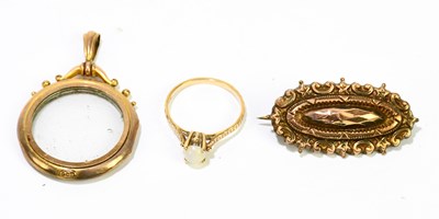 Lot 1223 - A 9ct yellow gold dress ring set with a single...