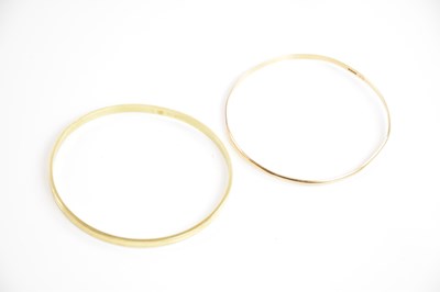 Lot 224 - Two 14ct gold fixed bangles, internal widths...