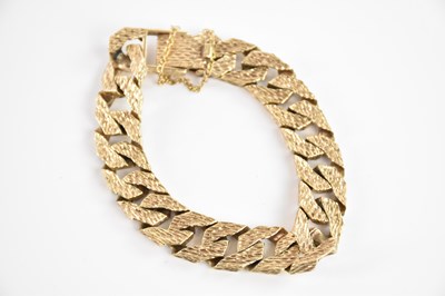 Lot 208 - A substantial 9ct textured yellow gold curb...