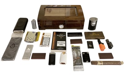 Lot 274 - A modern humidor containing cigars, lighters...