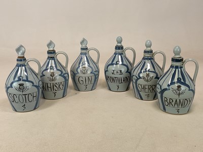 Lot 320 - BUCHAN HIGHLAND STONEWARE; six flagons with...