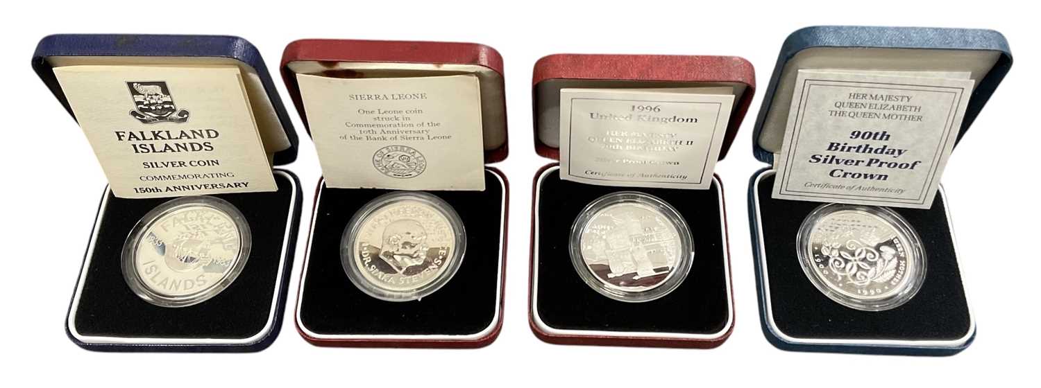Lot 1462 - ROYAL MINT; four silver coins comprising Her...