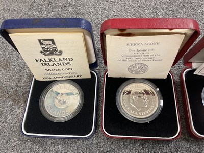 Lot 1462 - ROYAL MINT; four silver coins comprising Her...