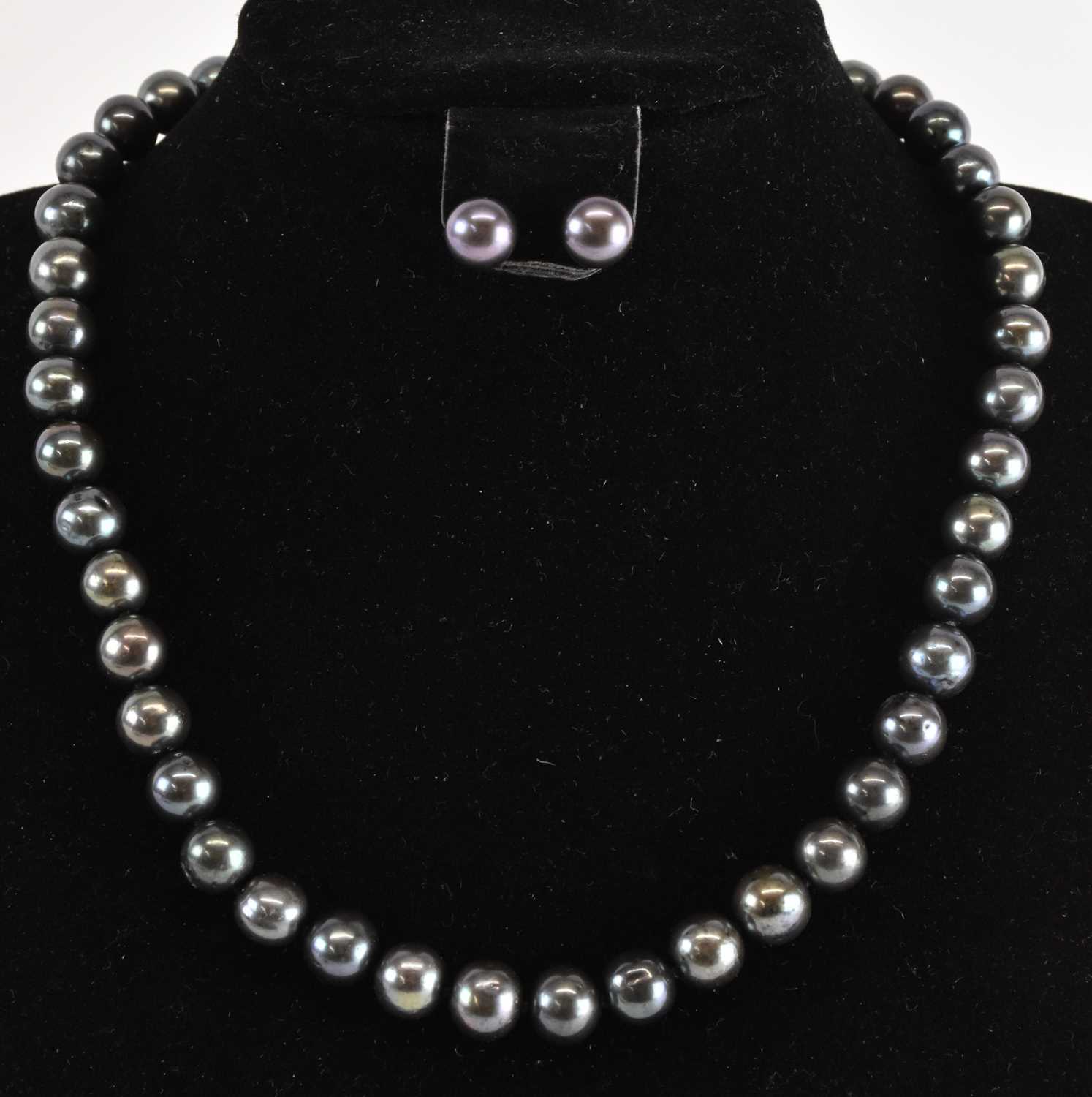 Lot 1227 - ANDERSON & WEBB; a cultured black pearl...