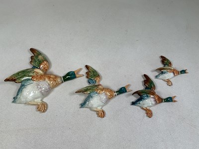 Lot 330 - BESWICK; a graduated set of four flying ducks,...