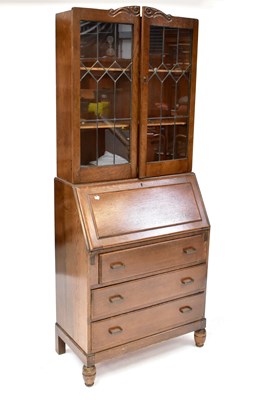 Lot 33 - An early 20th century oak bureau bookcase with...