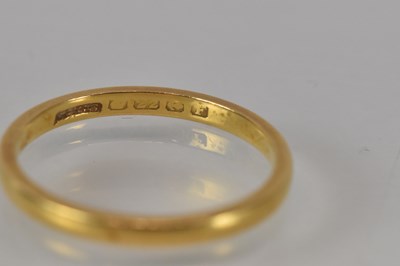 Lot 1150 - A 22ct yellow gold wedding band, size M/N,...