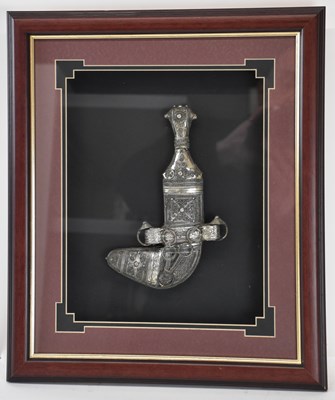 Lot 311 - A modern framed Arabian jambiya style white...