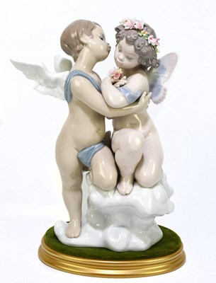 Lot 505 - LLADRO; a ceramic figure group of two cherubs,...