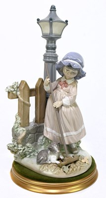 Lot 498 - LLADRO; a figure of a girl sweeping beside a...